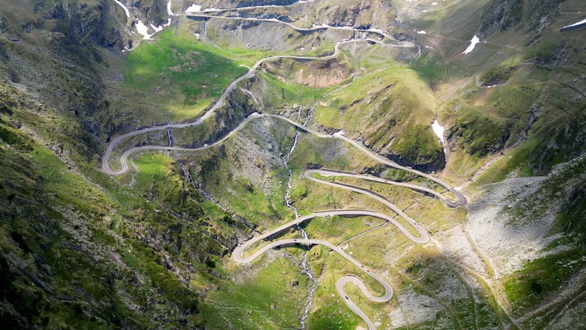 Aerial footage of the Transfagarasan curved road, one of the most iconic roads in the world. Drone video taken on June 8 2025, Sibiu County, Romania.