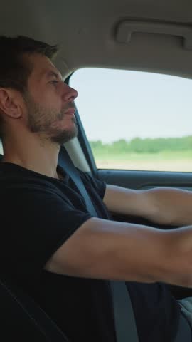Exhausted person closing eyes and loose concentration behind steering wheel during drive. Tired man falling asleep while driving car on highway road. Concept of driver fatigue and dangerous driving