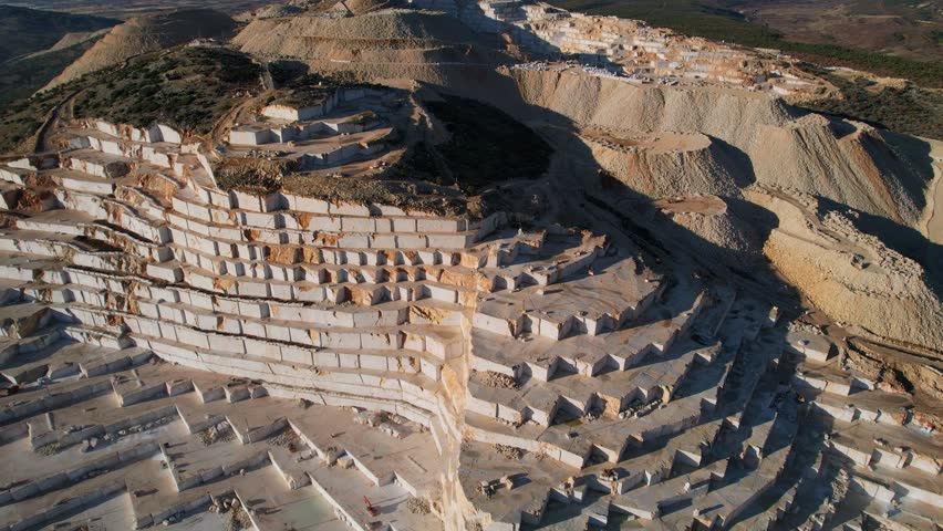 Industry marble quarry and cut white blocks, aerial top view Turkey destruction environment.