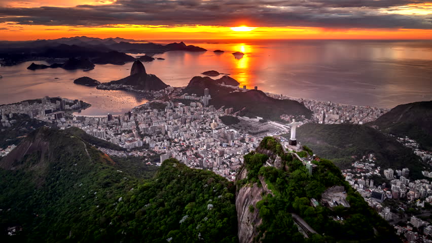 Christ the Redeemer atop Corcovado overlooking Rio at sunrise, drone hyperlapse