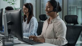 Happy multiethnic business agents operators working call center computer helpline diverse Indian Caucasian businesswomen African businessman headset speak phone online consultation callcenter office - Powered by Shutterstock - Get 15% off with code: PIKWIZARD15