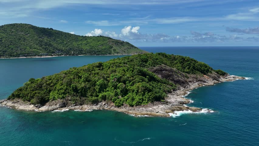 Picturesque small island located in the middle of the vast ocean surrounded by blue waters