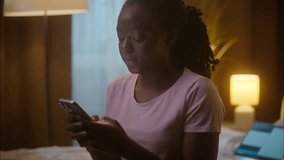 Annoyed angry nervous African American ethnic business woman female user lady girl freelancer tired businesswoman working late at home bedroom texting mobile phone arguing SMS online overwork laptop - Powered by Shutterstock - Get 15% off with code: PIKWIZARD15