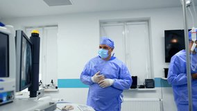 Chief surgeon points at the monitor displaying MRI scan of patient. Doctors consult and walk away. - Powered by Shutterstock - Get 15% off with code: PIKWIZARD15