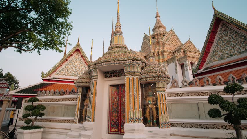 Wat pho temple, a landmark in Bangkok, intricate details and vibrant colors, inviting visitors to explore its rich history and cultural significance, Thailand