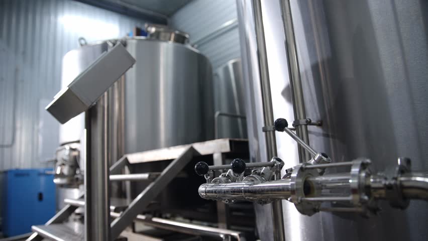 Stainless steel brewery equipment and beer production process in modern brewery.