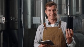 Brewer monitoring and managing fermentation process in modern brewery, worker hold holding aluminum can. - Powered by Shutterstock - Get 15% off with code: PIKWIZARD15