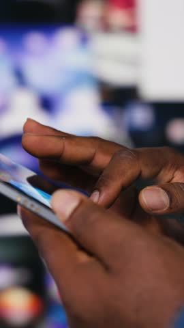 Vertical Video Young black user staying connected online on social network platforms, digital content and future of social engagement. Social media manager uses AI driven interactive web experience
