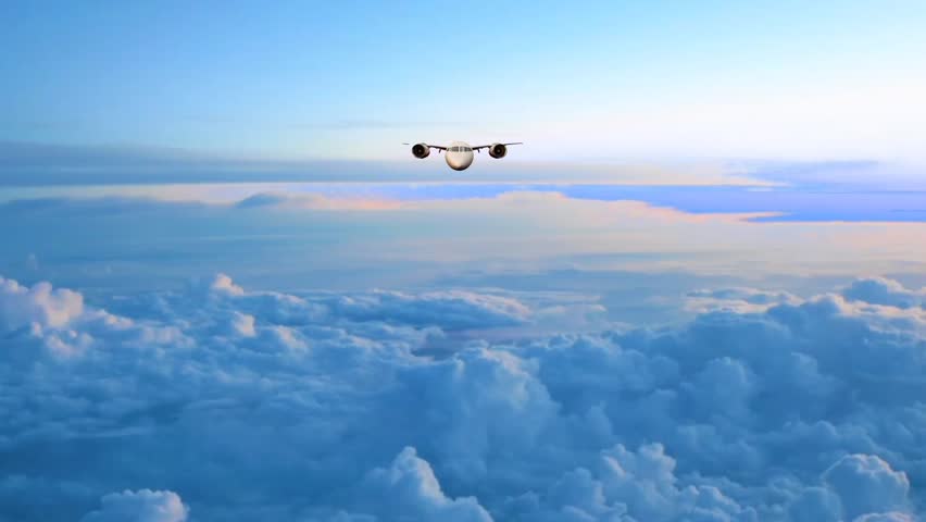 Airplane flying above the clouds