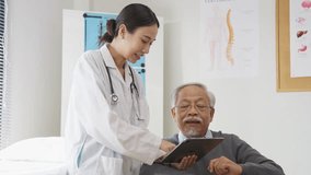 young professional female doctor attentively discusses a medical condition related to bone health with an elderly male patient seated in a wheelchair. In a warm, well-lit clinic setting, she explains  - Powered by Shutterstock - Get 15% off with code: PIKWIZARD15
