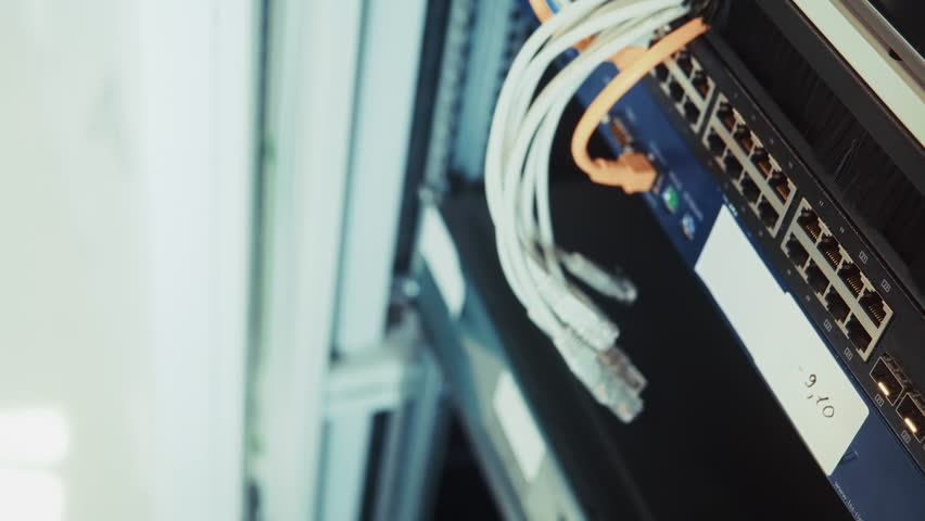 data transfer, internet connectivity, and IT infrastructure management.Modern server room with blinking Ethernet lights, LAN cables, and network switch. Data center infrastructure for cloud computing