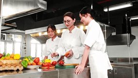 Chef instructor mentoring two young culinary students in a modern commercial kitchen during a hands-on cooking class with fresh vegetables. Ideal for chef school, culinary arts, and food training. - Powered by Shutterstock - Get 15% off with code: PIKWIZARD15