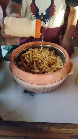 Watch as delicious french fries are freshly made! Hot, crispy, and golden, these fries are the perfect fast food treat. Great for food blogs, restaurant promos, and anyone who loves a good snack!