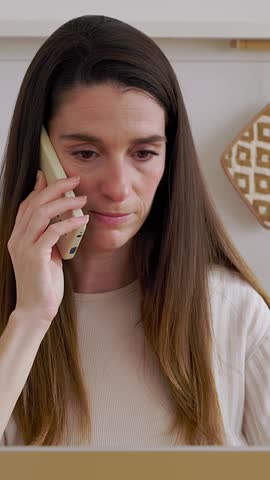 Young angry woman talking on phone disputing over laptop problem, stressed unsatisfied impatient customer arguing by mobile solving online difficulty with technical support complain on bad service 