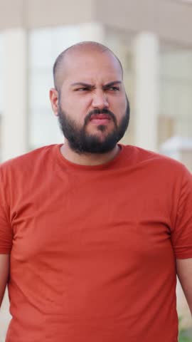 Vertical Video of Bald indian Man Feeling Uncomfortable By Foul Smell