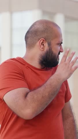 Vertical Video of Bald indian Man Feeling Uncomfortable By Foul Smell