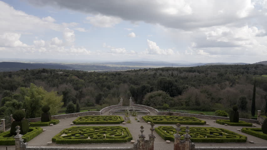 Clouds passing over italian formal garden and landscape. Action