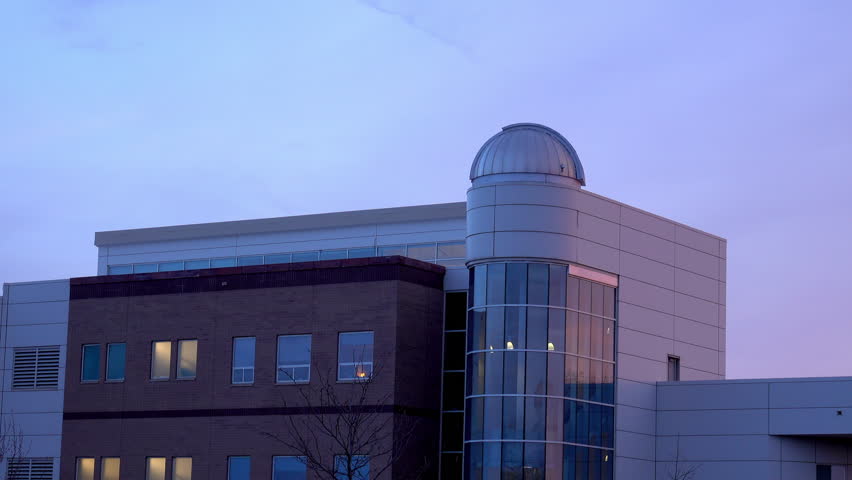 Science building at a college with an observatory dome.