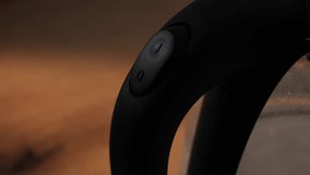 Hand presses button on kettle to start water boiling process - Powered by Shutterstock - Get 15% off with code: PIKWIZARD15