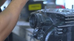 Engine block under maintenance, mechanic's hands background - Powered by Shutterstock - Get 15% off with code: PIKWIZARD15