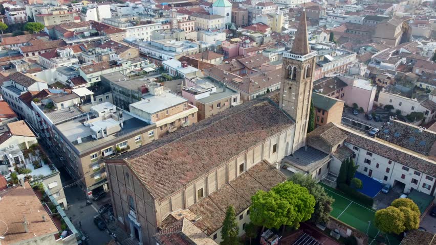 Aerial drone footage of Rimini, a popular coastal city in Emilia-Romagna, Italy, showing beaches, the Adriatic Sea, historic center, and cityscape in warm daylight.
