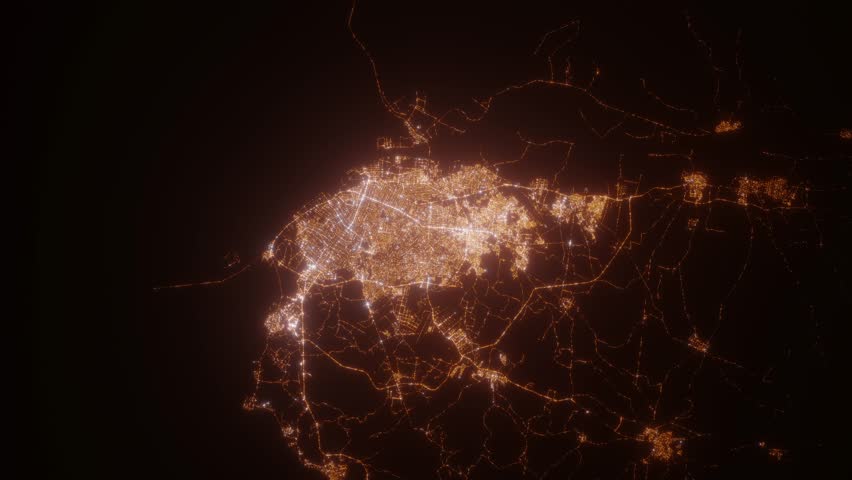 Barranquilla (Colombia) top view at night. Top view on modern city with street lights and glow effect. Camera is zooming in, rotating clockwise. Vertical video. The north is on the left side