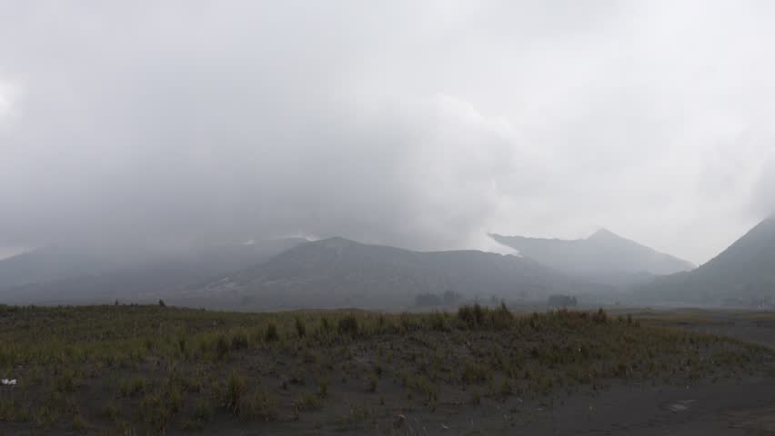 Mount Bromo active volcano hot sulfur steam geothermal activity Java Indonesia landscape