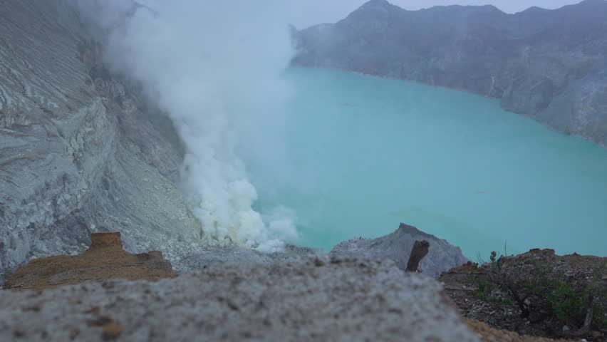 Sulfur toxic plume Ijen volcano lake Kawah Java island Indonesia nature crater
