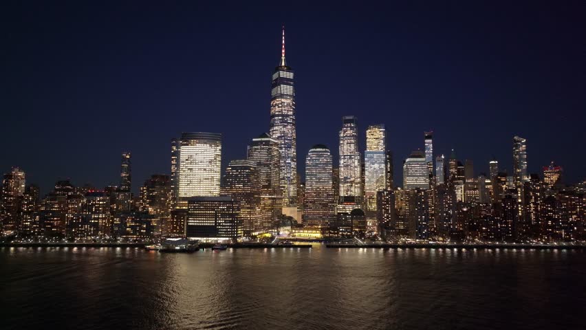 Night View Of New York Skyline At Manhattan In New York United States. City At Night Landscape. Illuminated Downtown. New York Skyline At New York United States. Highrise Buildings Scenery.