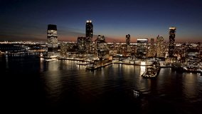 Sunset Skyline In Jersey City In New Jersey United States. Sunset Landscape. Metropolitan District. Jersey City Skyline At New Jersey United States. Highrise Buildings Scenery. - Powered by Shutterstock - Get 15% off with code: PIKWIZARD15
