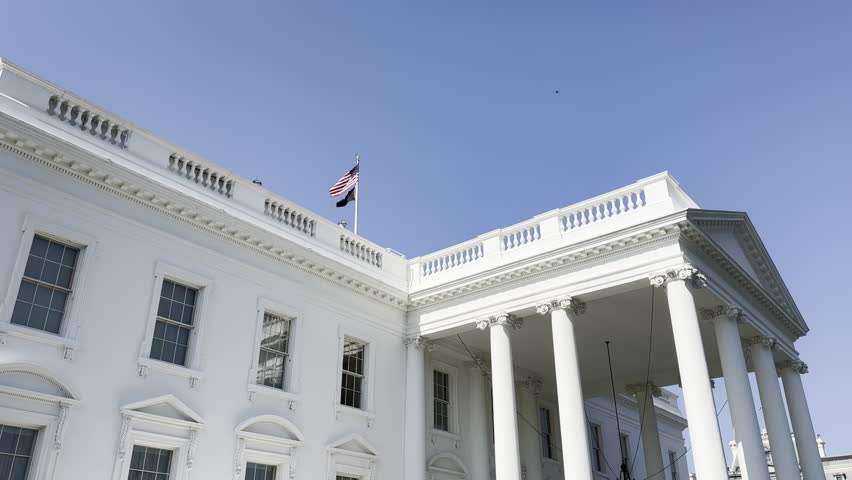 Close up low angle view of the White House from front lawn in Washington DC
