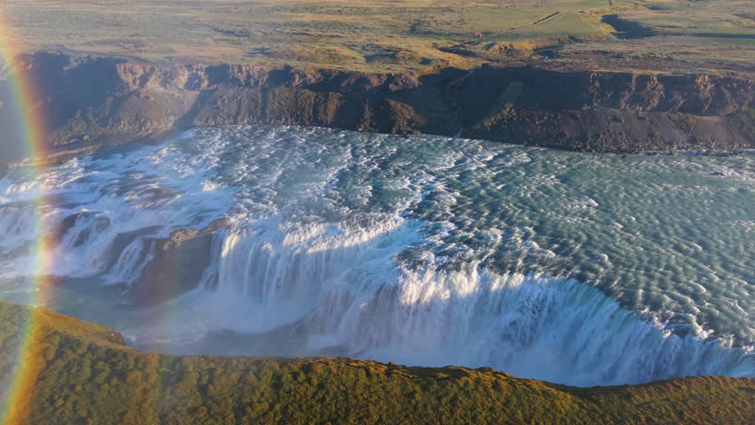 Aerial Views of a Majestic Waterfall Gullfoss Accompanied by a Rainbow. Iceland