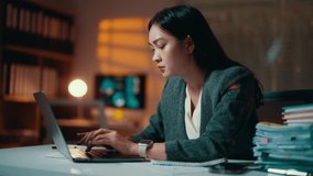 Professional businesswoman experiencing workplace stress while working late, checking time on smartwatch and showing signs of exhaustion and deadline pressure in dark office environment - Powered by Shutterstock - Get 15% off with code: PIKWIZARD15