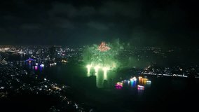 Vibrant fireworks illuminating han river, creating dynamic light reflections against da nang cityscape, showcasing dazzling nighttime celebration of vietnamese festive atmosphere - Powered by Shutterstock - Get 15% off with code: PIKWIZARD15