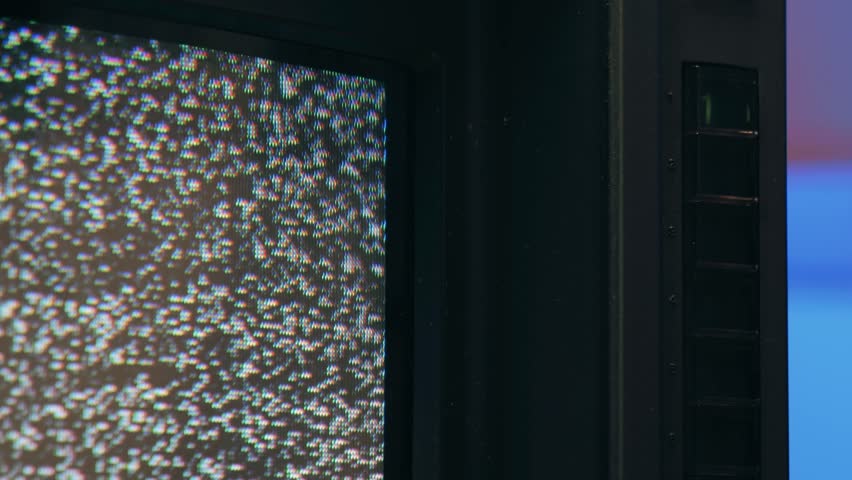 Retro TV, vintage television In a nostalgic setup, a retro TV displays grain on screen, scary halloween night device good for chroma key and green screen.