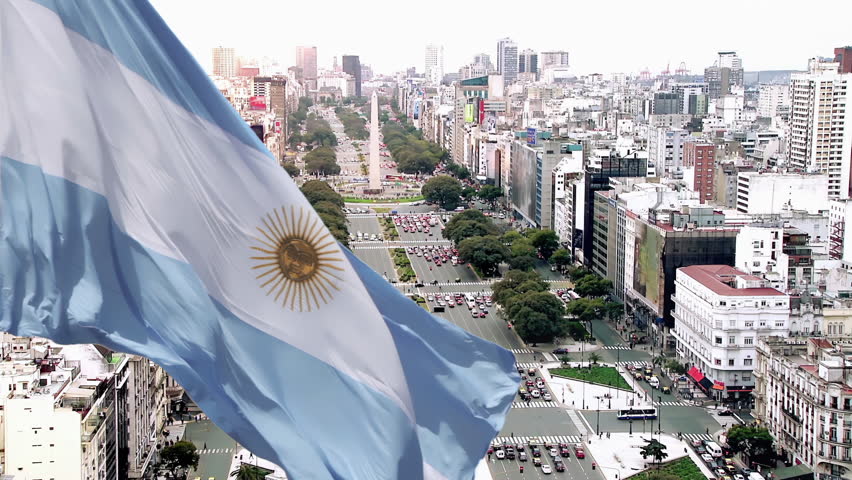 Argentine Flag Waving Over Avenida 9 de Julio and Obelisco From Elevated Angle, Buenos Aires, Argentina, 4K