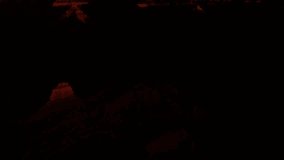 Day breaks from darkness and deep shadows to fill the Grand Canyon with rich morning sunlight. - Powered by Shutterstock - Get 15% off with code: PIKWIZARD15