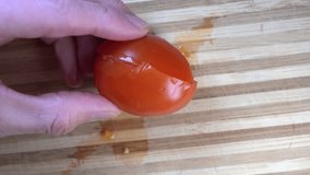 Preparing fresh salad. Cut the cherry tomatoes in slow motion with a knife on a wooden board. Cutting vegetables with a top view. Slow motion cooking video. Fresh italian recipe - Powered by Shutterstock - Get 15% off with code: PIKWIZARD15