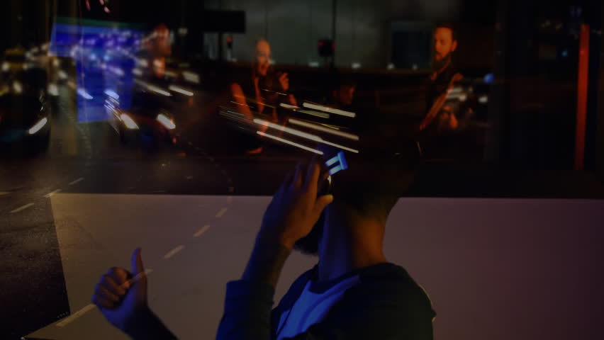 Sound engineer sliding faders, donning headphones in studio, merging city lights with band mix. Studio, gear, nightlife, sound, urban, ambience, technology