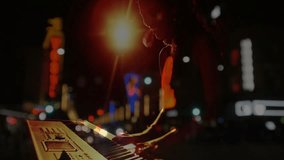 Woman musician pressing keyboard keys launching gentle melody profile emerging against neon street. Night, cityscape, nightlife, performance, illumination, melody, urban - Powered by Shutterstock - Get 15% off with code: PIKWIZARD15