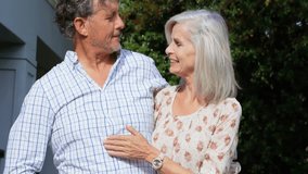 Senior couple raising smartphone for selfie on social media outside house, with emojis floating. Elderly, romance, outdoor, affection, connectivity, happiness, foliage - Powered by Shutterstock - Get 15% off with code: PIKWIZARD15