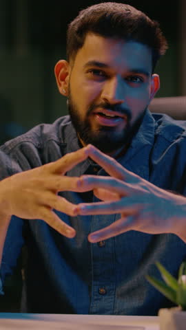 Indian man smiling positive guy male business coach businessman mentor influencer leader entrepreneur HR manager at dark night office talking to camera consultation motivation speech teaching consult