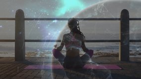 woman practicing wellness meditation on yoga mat, sunrise inspiring cosmic globe enveloping figure. Spirituality, serenity, transcendence, mindfulness, cosmic, peaceful, introspection - Powered by Shutterstock - Get 15% off with code: PIKWIZARD15