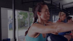 Sparkling particles appearing in gym initiating fitness group performing squats engaging core. Fitness, teamwork, exercise, vitality, motivation, training, performance - Powered by Shutterstock - Get 15% off with code: PIKWIZARD15