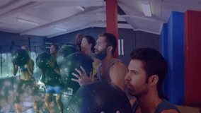 group holding medicine balls by mirror wall initiating group squatting boosting leg strength in gym. Strength training, teamwork, fitness, gym, exercise, motivation, sport - Powered by Shutterstock - Get 15% off with code: PIKWIZARD15