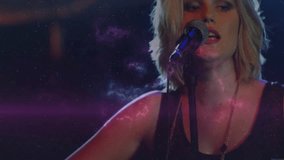 Female musician pressing guitar neck activating nebula while strumming singing for live music show. Galaxy, melody, performance, atmosphere, energy, inspiration, artistic - Powered by Shutterstock - Get 15% off with code: PIKWIZARD15