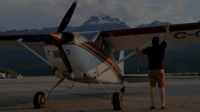 Pilot walking to plane at airfield, inspecting wing, opening cockpit, climbing, doing flight checks. Aviator, aviation, adventure, travel, aircraft, scenic, outdoors - Powered by Shutterstock - Get 15% off with code: PIKWIZARD15