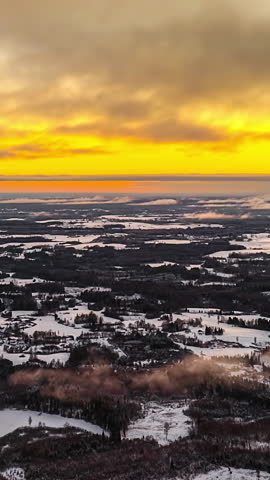 Orange Skies Over Snowy Landscape In Winter At Dusk. - vertical, timelapse shot