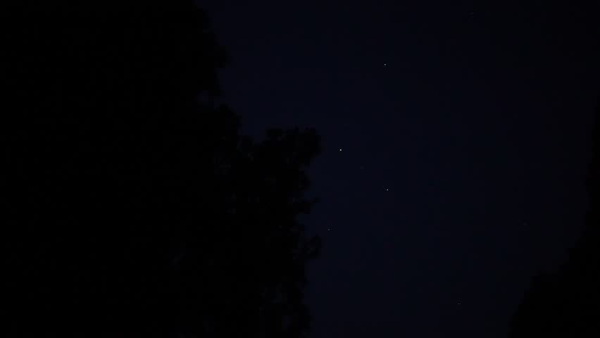 Japanese firefly or Nipponoluciola cruciata or Genji-botaru flying over Kobara River at Firefly Kingdom in Fukumaki, Tottori, Japan on June 28, 2025
