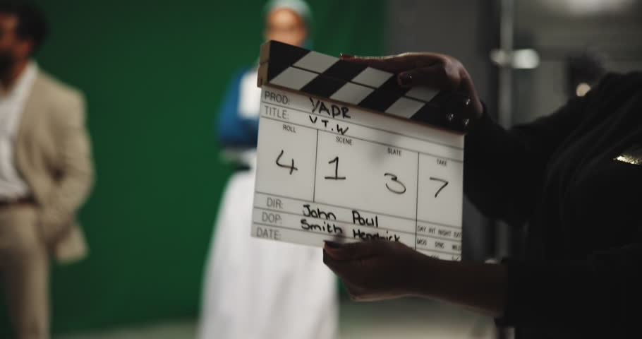 Production, people and movie slate for shoot, actor and process in studio, art or behind the scenes. Media, team and clapperboard for visual cue, creative and director with equipment for filming